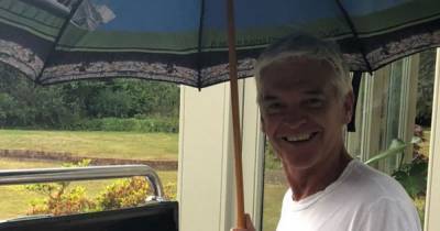 Phillip Schofield - Phillip Schofield braves the elements as he insists on barbecuing as the heavens open - mirror.co.uk