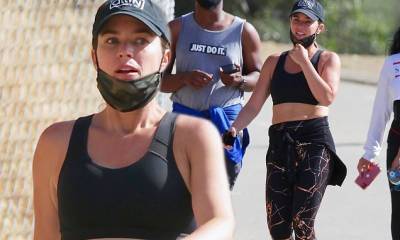 Teddi Mellencamp bares her toned midriff in a black sports bra during an morning hike with friends - dailymail.co.uk - Los Angeles