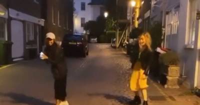 Laura Whitmore - Iain Stirling - Laura Whitmore's socially-distanced dance moves as she jives with a pal in the street - mirror.co.uk