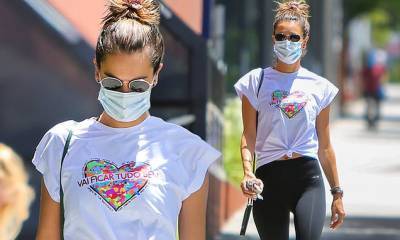 Alessandra Ambrosio - Alessandra Ambrosio wears a white top and black leggings while arriving at the gym in Brentwood - dailymail.co.uk - state California - city Los Angeles - Los Angeles, state California - Brazil