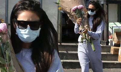 Shay Mitchell - Shay Mitchell stays comfortable in sweats as she buys multiple bouquets for a special occasion - dailymail.co.uk