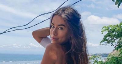 Instagram model hailed for 'relatable' post while posing in bikini on the beach - dailystar.co.uk - city Dubai