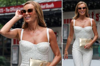 Amanda Holden - Amanda Holden shows off bronzed tan in white jumpsuit as she leaves work in the rain - thesun.co.uk