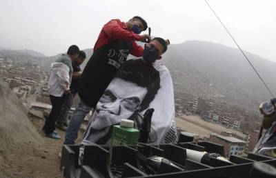 Barber offers hope in Peruvian barrios devastated by virus - clickorlando.com - city Lima - Peru