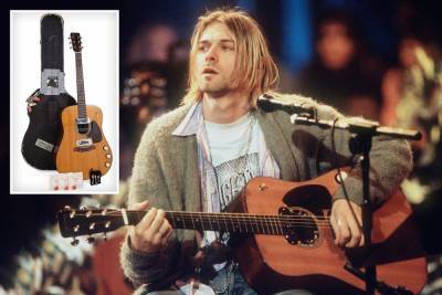 Kurt Cobain - David Gilmour - Kurt Cobain’s iconic acoustic guitar from Nirvana’s MTV Unplugged performance sells for record £4.8million - thesun.co.uk - New York - city Beverly Hills
