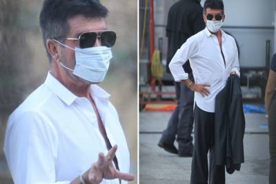 Simon Cowell - Simon Cowell takes no risks as he returns to work in California wearing a face mask and shades - thesun.co.uk - state California