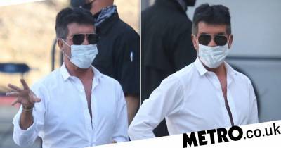 Simon Cowell - Simon Cowell takes precautions as he heads back to work in California wearing face mask - metro.co.uk - Los Angeles - state California - city Los Angeles - county Valley