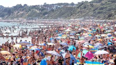 On hottest day of year, thousands cram onto English beaches - fox29.com - Britain