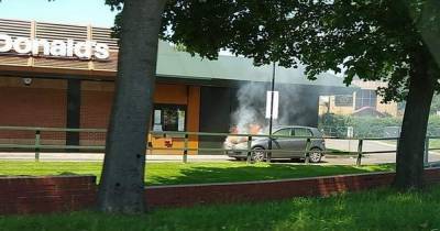 McDonald’s customers forced to flee as car busts into flames in drive-thru lane - dailystar.co.uk - county Wake