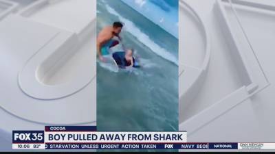 'Hey buddy, there's a shark right there!': Off-duty police officer pulls boy away from shark - fox29.com