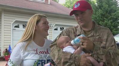 Air Force technical sergeant returns home from deployment, meets baby for first time - fox29.com