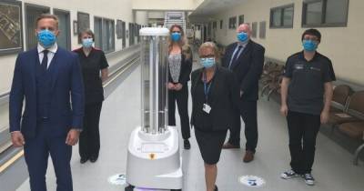 Robots to fight coronavirus by roaming hospitals and killing germs with UV light - dailystar.co.uk - Denmark