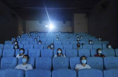 Some Chinese cities reopen cinemas as virus threat recedes - clickorlando.com - China - city Beijing - city Shanghai