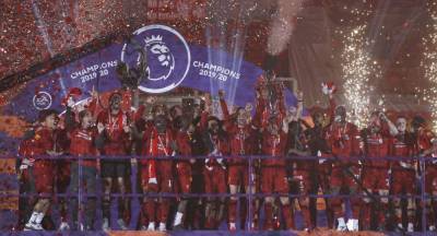 Liverpool players receive Premier League trophy on Kop - clickorlando.com - Britain - Jordan