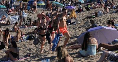 Boozy Brits in Barcelona ordered to stop partying to curb coronavirus spike - dailystar.co.uk - Spain - Britain