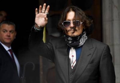 Johnny Depp - Dan Wootton - Amber Heard - In libel case, Depp denies hitting ex-wife Amber Heard - clickorlando.com - Britain - county Heard