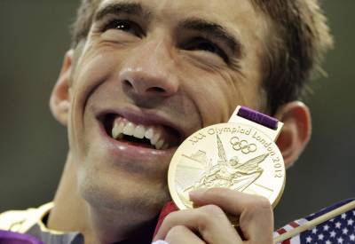 Michael Phelps - In 2012, Bolt, Phelps cemented legendary status at Olympics - clickorlando.com - city London - Jamaica
