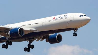 Delta flight turns around after 2 passengers refuse to wear coronavirus masks - fox29.com - city Atlanta - city Detroit