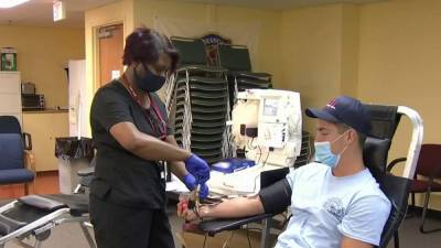 After recovering from COVID-19, Orlando firefighters donate plasma to help others - clickorlando.com