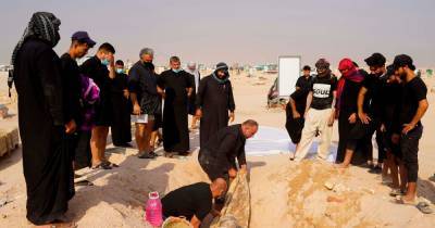 Hundreds of Covid-19 victims' corpses dug up from Iraqi 'coronavirus cemetery' - dailystar.co.uk - Iraq