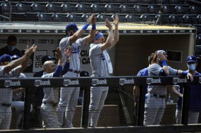 Will Smith - Chris Taylor - Dustin May - Dodgers 1st team to clinch playoff spot, beat Padres 7-5 - clickorlando.com - Los Angeles - city Los Angeles - county San Diego