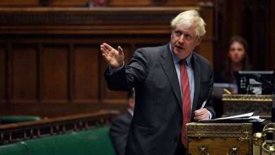 Boris Johnson - COVID 'firepower': Britain imposes 6-month curbs against second wave - livemint.com - Britain