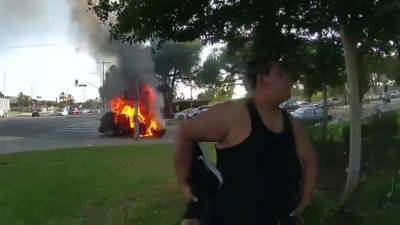 LAPD rescues wheelchair-bound man from vehicle moments before it bursts into flames in dramatic video - fox29.com - Los Angeles - city Los Angeles