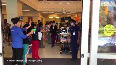 Hospital staff cheers as 13-year-old COVID-19 survivor is discharged after 57 days in ICU - fox29.com - county Orange