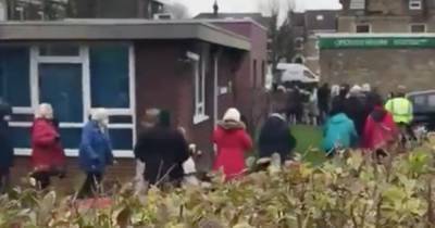 Elderly patients filmed queuing in freezing cold outside clinic to get coronavirus jabs - dailystar.co.uk