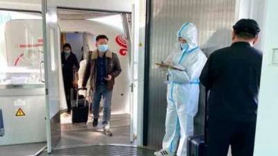 WHO team lands in China's Wuhan to probe coronavirus origin: Report - livemint.com - China - city Wuhan, China - Singapore - city Singapore