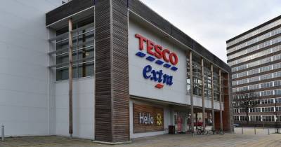 Tesco shuts superstore after huge Covid outbreak infects 50 staff and 'kills one' - dailystar.co.uk - city Manchester