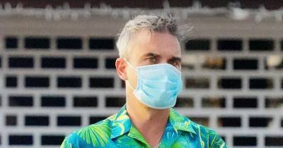 Robbie Williams - Robbie Williams leaves St Barts as he's back on his feet after Covid-19 battle - mirror.co.uk