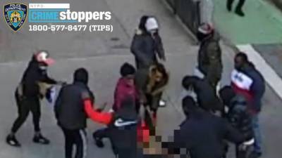 Arrests made after large group beats, strips man in Chinatown - fox29.com - New York - city Chinatown