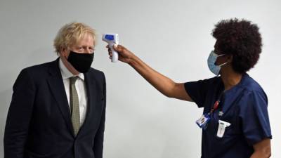 Boris Johnson - New UK lockdown issued until mid-February to combat fast-spreading COVID-19 strain - fox29.com - Britain