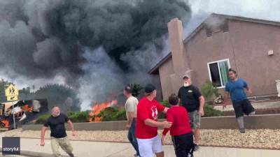 VIDEO: Bystanders rescue woman from burning home after plane crashes, killing 2 in SoCal - fox29.com - county San Diego - city Santee