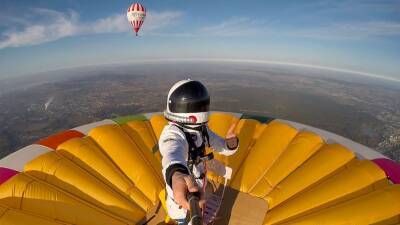 French man breaks world record for standing on top of hot air balloon at altitude - fox29.com - Britain - France