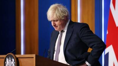 Boris Johnson - UK tightens COVID-19 rules as 2 omicron variant cases emerge in country - fox29.com - Britain