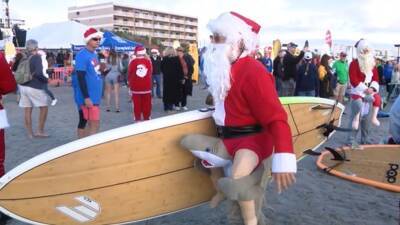 Surfing Santas returns to Cocoa Beach with large crowds - fox29.com - county Brevard - city Santas