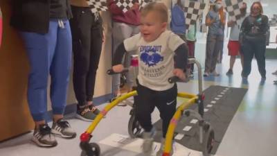 Toddler, paralyzed from neurological disorder, given celebratory sendoff as he walks out of hospital - fox29.com - state Ohio - city Akron, state Ohio