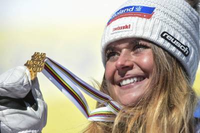 Riding high: Suter wins downhill for her 1st gold at worlds - clickorlando.com - Switzerland
