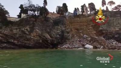 Firefighters work to recover coffins from the sea after landslide hits Italian cliffside cemetery - globalnews.ca - Italy