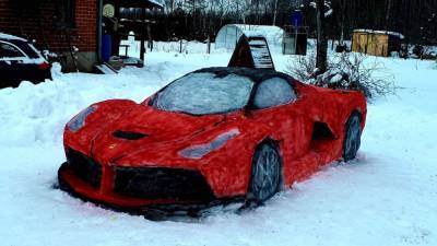 Couple carves their own life-size red Ferrari out of snow - fox29.com