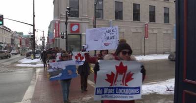Coronavirus: Protesters march down Kingston streets over stay-at-home orders - globalnews.ca - city Kingston - Ontario