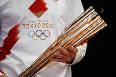 Tokyo Olympic torch relay: Masks, quiet cheering and caution - clickorlando.com - Japan - city Tokyo - prefecture Fukushima