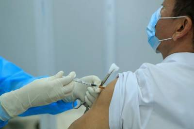Vietnam vaccinates COVID-19 front-liners with its 1st doses - clickorlando.com - Vietnam - city Hanoi