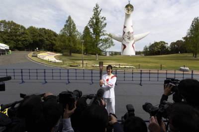 Olympic torch runs through empty park in Osaka as cases rise - clickorlando.com - Japan - city Tokyo