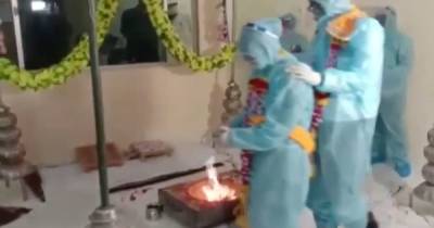 Couple tie the knot in full PPE after groom tests positive as Covid tears through India - mirror.co.uk - India