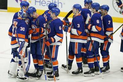 Andrew Cuomo - The Latest: Islanders to have fully vaccinated fan section - clickorlando.com - New York - city New York - city Nassau