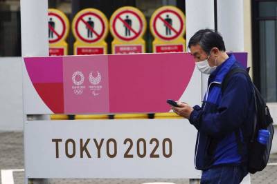 Yoshihide Suga - Frustration in Japan as leader pushes Olympics despite virus - clickorlando.com - Japan - city Tokyo