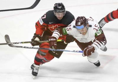 Host Latvia beats Canada 2-0 in world hockey opener - clickorlando.com - Canada - Latvia - city Riga